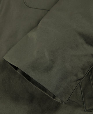 Olive deck jacket with stitched front pocket panel and angled hem detail