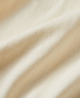 Off-white cotton T-shirt fabric texture close-up