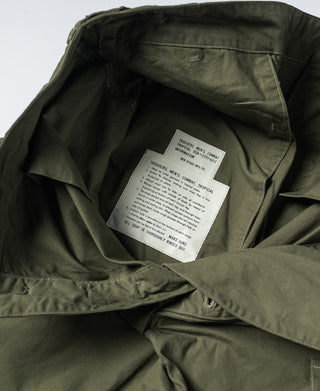 Olive fatigue pants interior with printed care label