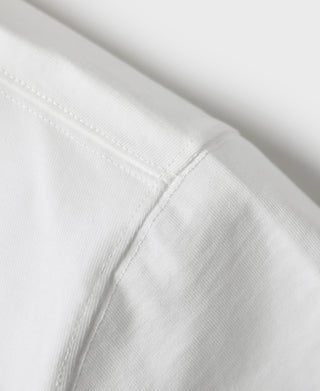 White short sleeve henley T-shirt sleeve seam close-up