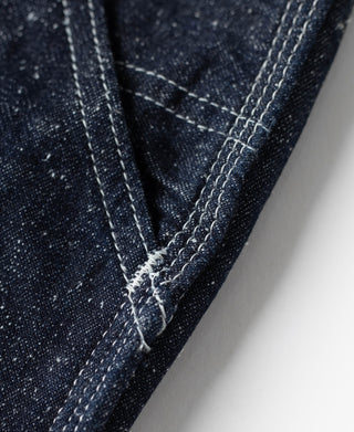 Indigo denim carpenter pants diagonal seam and stitched strap with reinforced corner