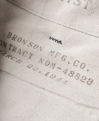 Navy trouser inner seam with printed brand and care text