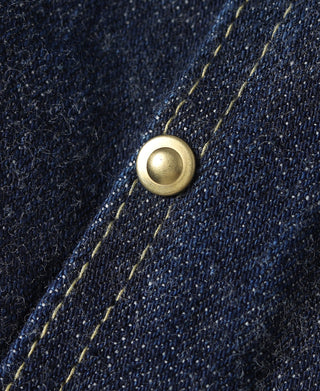 Indigo denim jacket snap button detail with contrast yellow stitch lines