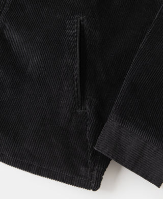 Black corduroy jacket sleeve cuff and side seam with ribbed trim