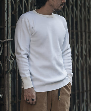 White heavyweight waffle cotton long-sleeve underwear top on a person