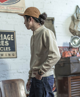 Khaki corduroy 5-panel cap worn facing left