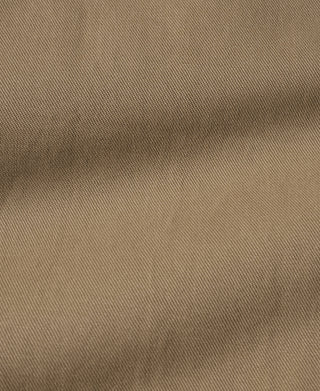 Khaki canvas-like trouser fabric texture close-up