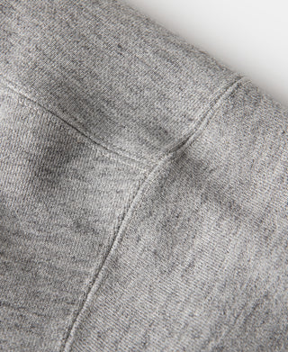 Gray sweater side seam with double V-neck insert stitching