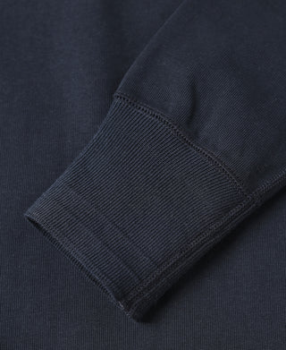 Navy henley shirt ribbed cuff detail on the long sleeve.