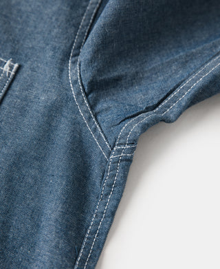 Blue chambray work shirt side seam and curved slit hem edge