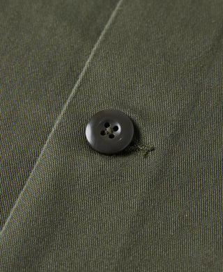 Olive fatigue utility shirt button detail on placket with visible stitching