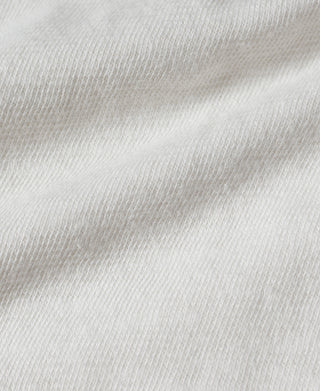 White henley T-shirt knit close-up, smooth fabric surface