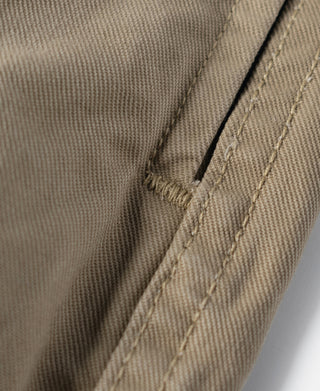 Khaki combat pants side seam with reinforced stitching and slit opening