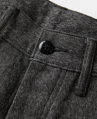 Salt-and-pepper trousers fly and button detail with front pocket