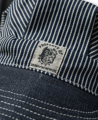 Striped railroad engineer cap close-up of front logo patch on brim