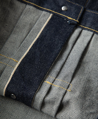 Indigo denim jacket cuff detail with pleated lining and snap closure