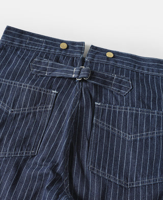 Indigo pinstripe pants front with pleats and central waist tie closure