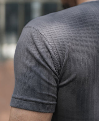 Dark gray ribbed T-shirt with crew neck and brand label