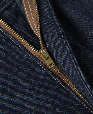 Indigo denim painter pants with brass zipper and logo zipper pull