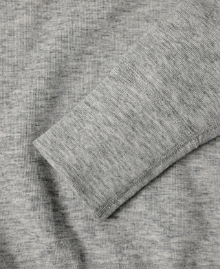 Gray heather knit fabric with seam and fold detail on henley shirt