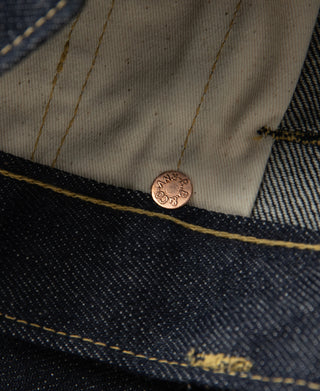 Indigo denim jeans coin pocket with copper rivet and off-white inner fabric