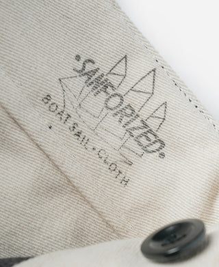 Inside waistband label and button on striped pants