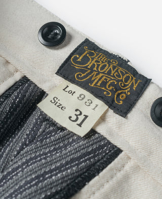 Inside label reading “Lot 931” and “Size 31” on striped pants