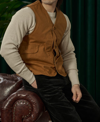 Ginger-brown canvas button-front vest with V-neck and chest patch pockets