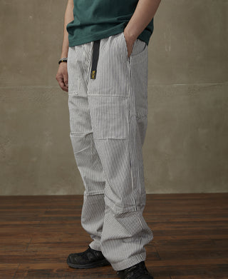 Striped loose pants with wide legs and side pockets, vertical dark-and-white stripes