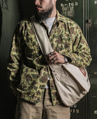 Duck hunter camo jacket with button front and chest pockets, long sleeves