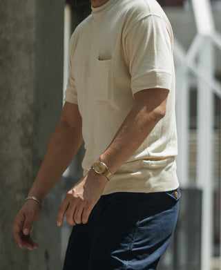 Light apricot waffle-knit pocket T-shirt on model, short sleeves visible