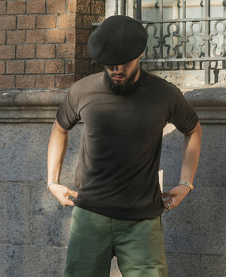 Black waffle-knit crew-neck T-shirt with chest pocket, relaxed drape