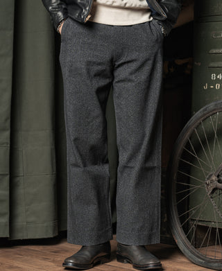 Salt and pepper trousers with zip fly, front pleats, and wide straight legs