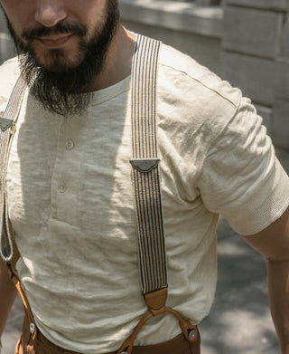 Cream white slub cotton henley T-shirt close-up, three-button placket and collar
