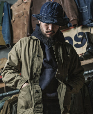 Olive utility jacket, button front with multiple flap pockets and stand collar