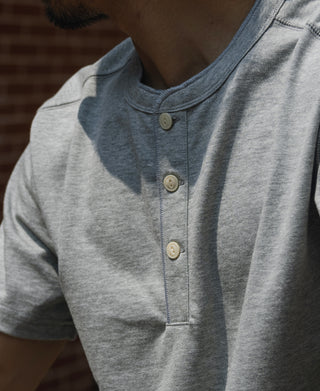 Gray cotton henley T-shirt close-up of three-button front placket
