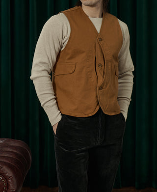 Ginger-brown canvas vest with V-neck and button front, two chest patch pockets