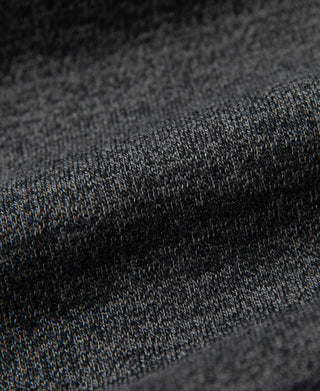 Dark gray jersey knit texture close-up on T-shirt fabric