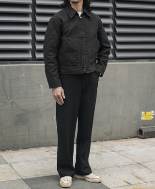 Black moleskin cossack jacket on model, front placket with buttons and stand collar