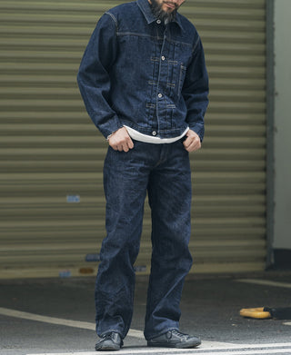Indigo denim jacket worn with button front and chest pockets; full outfit view