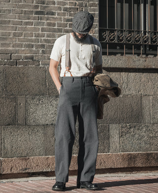 Apricot henley T-shirt with short sleeves and button-front, worn with dark overalls