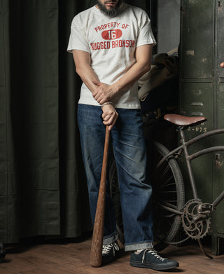 White drop-shoulder T-shirt with red 'PROPERTY OF 16 RUGGED BRONSON' front graphic