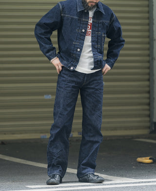 Indigo denim jeans on model, straight leg with belt loops and front seams