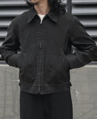 Black moleskin cossack jacket on model, stand collar and flap chest pockets