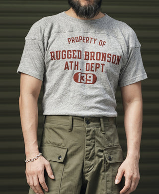 Gray crew T-shirt with red “RUGGED BRONSON” chest graphic and short sleeves