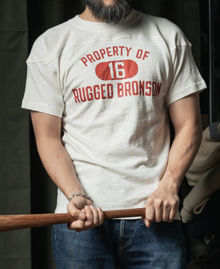 White drop-shoulder T-shirt back view with small printed 'PROPERTY OF 16' graphic