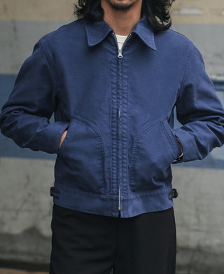 Blue moleskin cossack jacket with stand collar, zip-front, and flap pocket