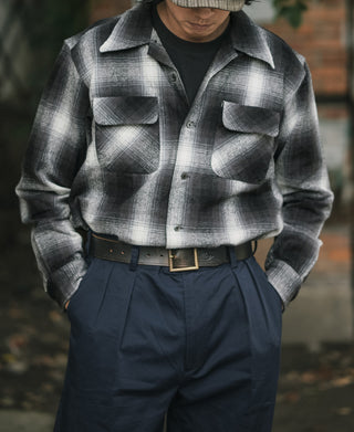 Black-and-white ombre check brushed cotton sports shirt with long sleeves and flap pockets.