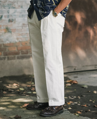 White cotton twill trousers with side seam detail and straight leg silhouette