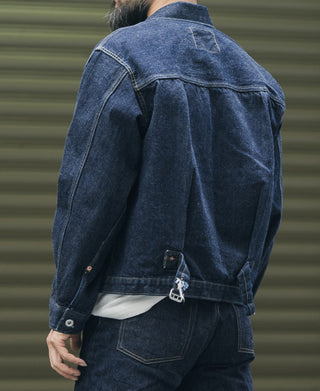 Indigo denim jacket back view with yoke panel and buttoned collar